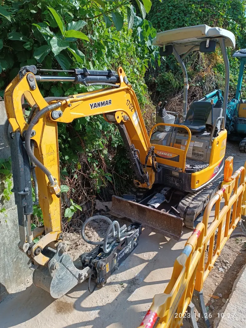 Yellow excavator on a construction site
