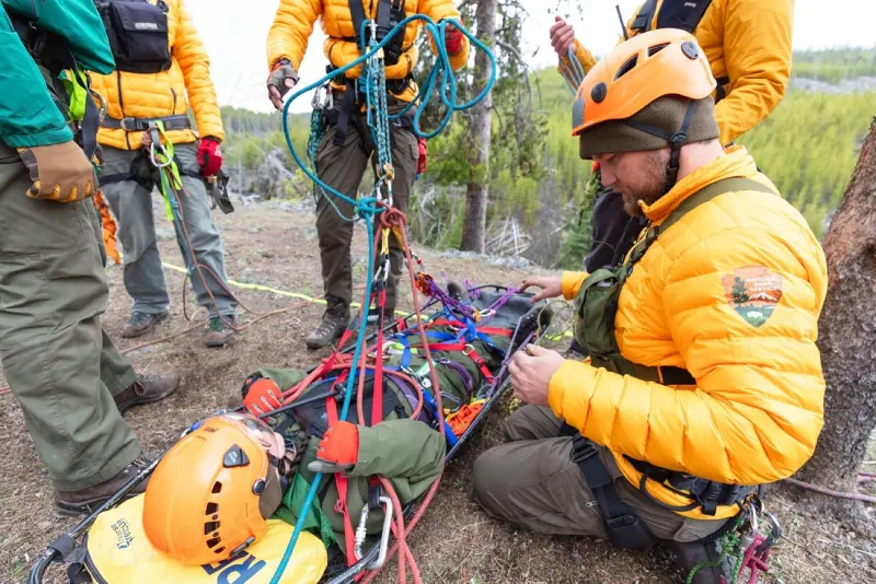 Rescue team preparing rope-rescue equipment